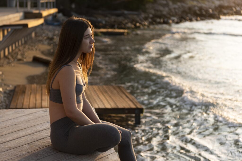 side view woman relaxing beach 1